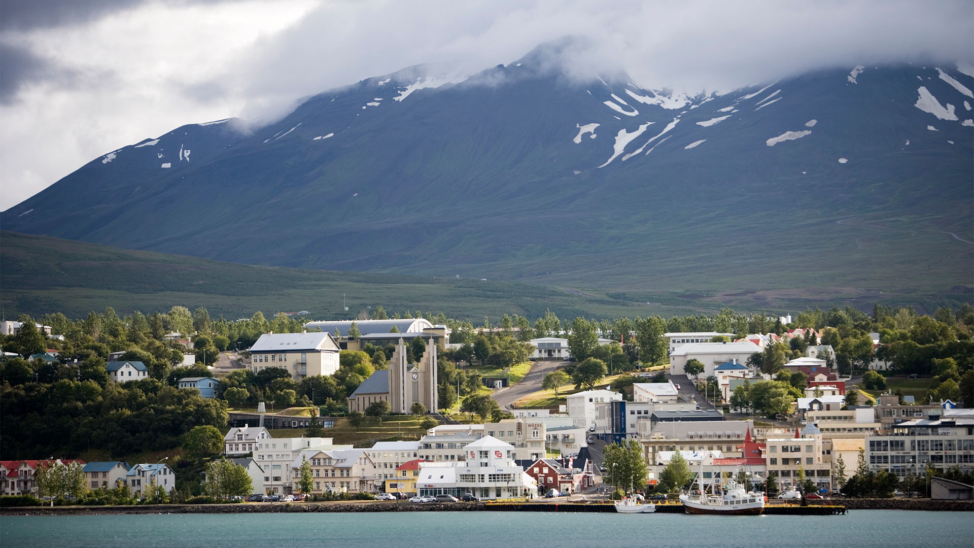 Akureyri Church and town beneath misty mountains