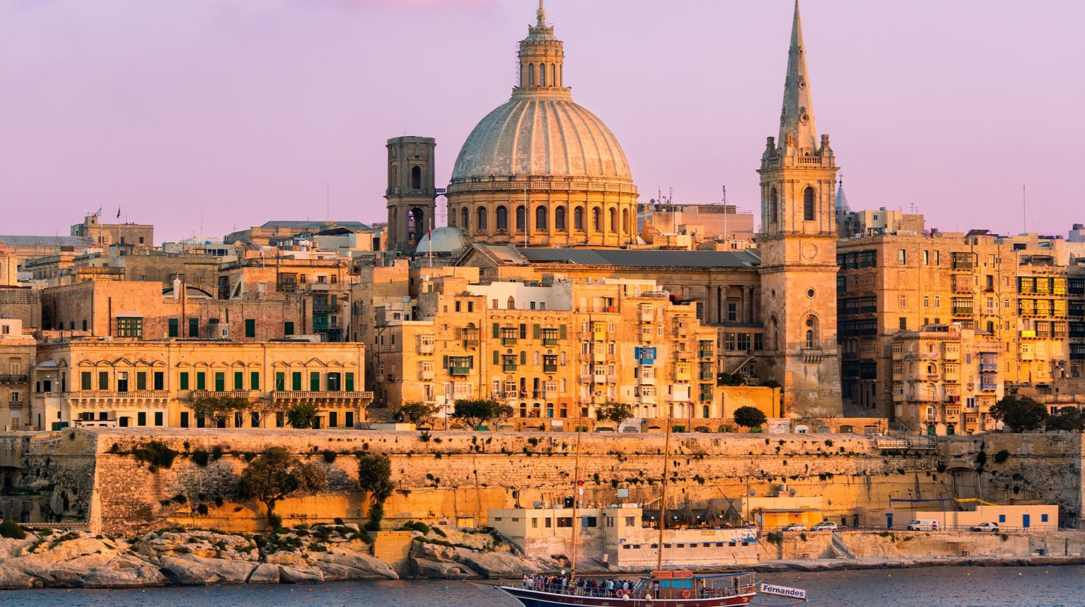 Skyline view of Valetta, the capital city of Malta, at dusk.