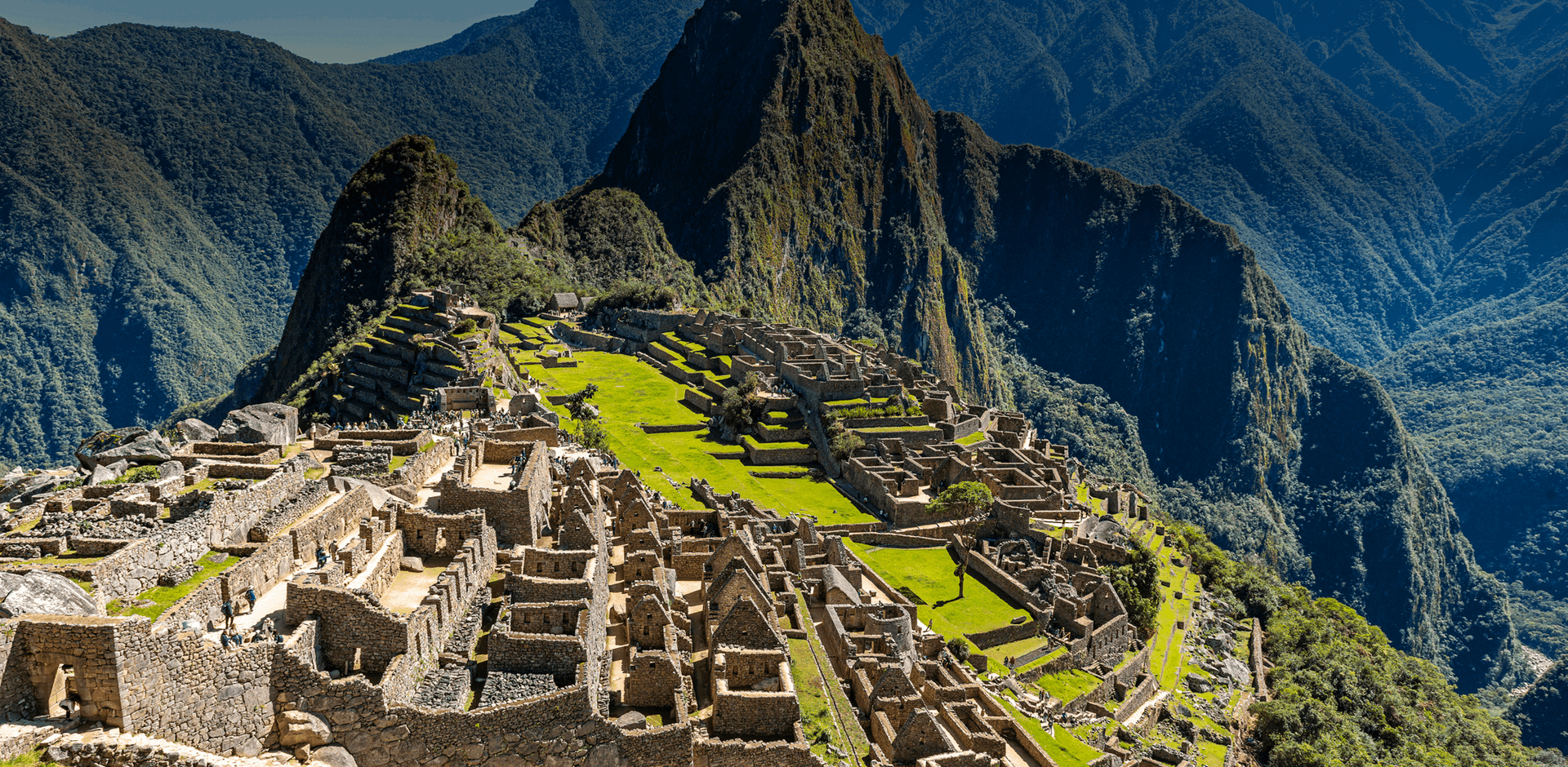 Overlooking from the top of Machu Picchu Inca Ruins and green mountains, Peru, South America.