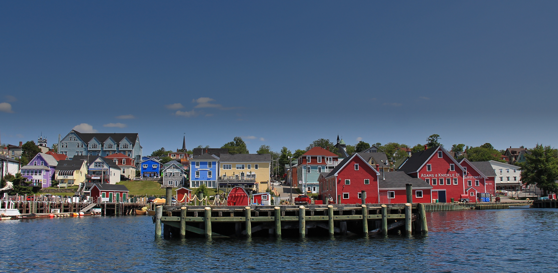 Water view on a Lunenburg port town with houses by the water, a UNESCO World Heritage, Nova Scotia in Canada