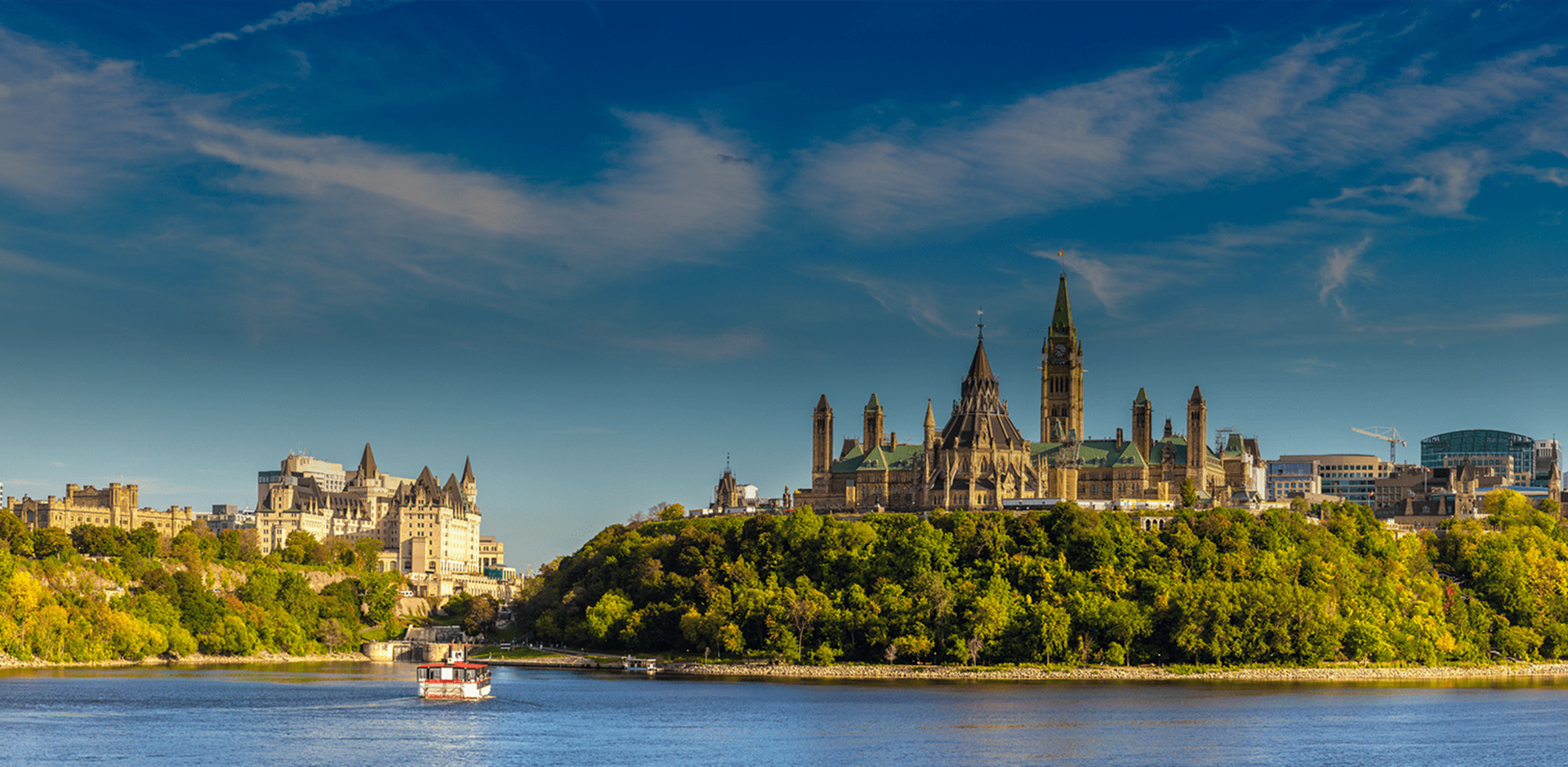 Look from the water on the Parliament, boat and other surroundings, Ottawa, ON