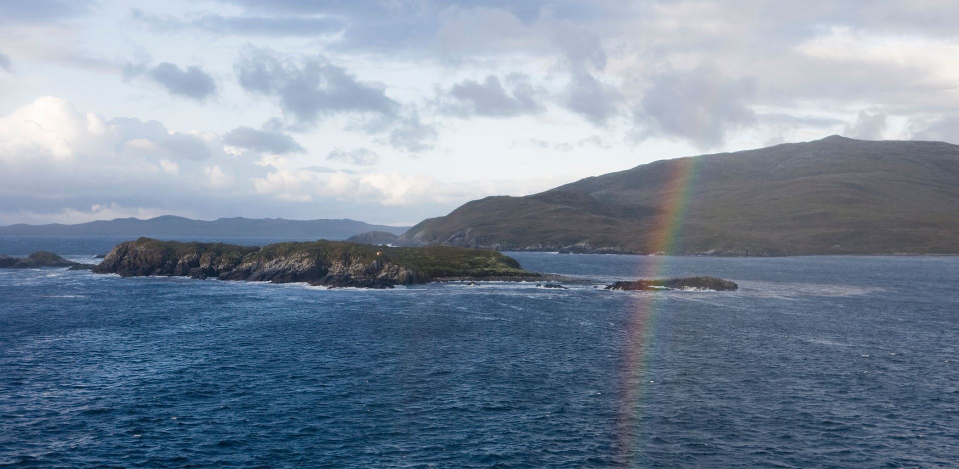Rainbow over the coastline near Cape Horn