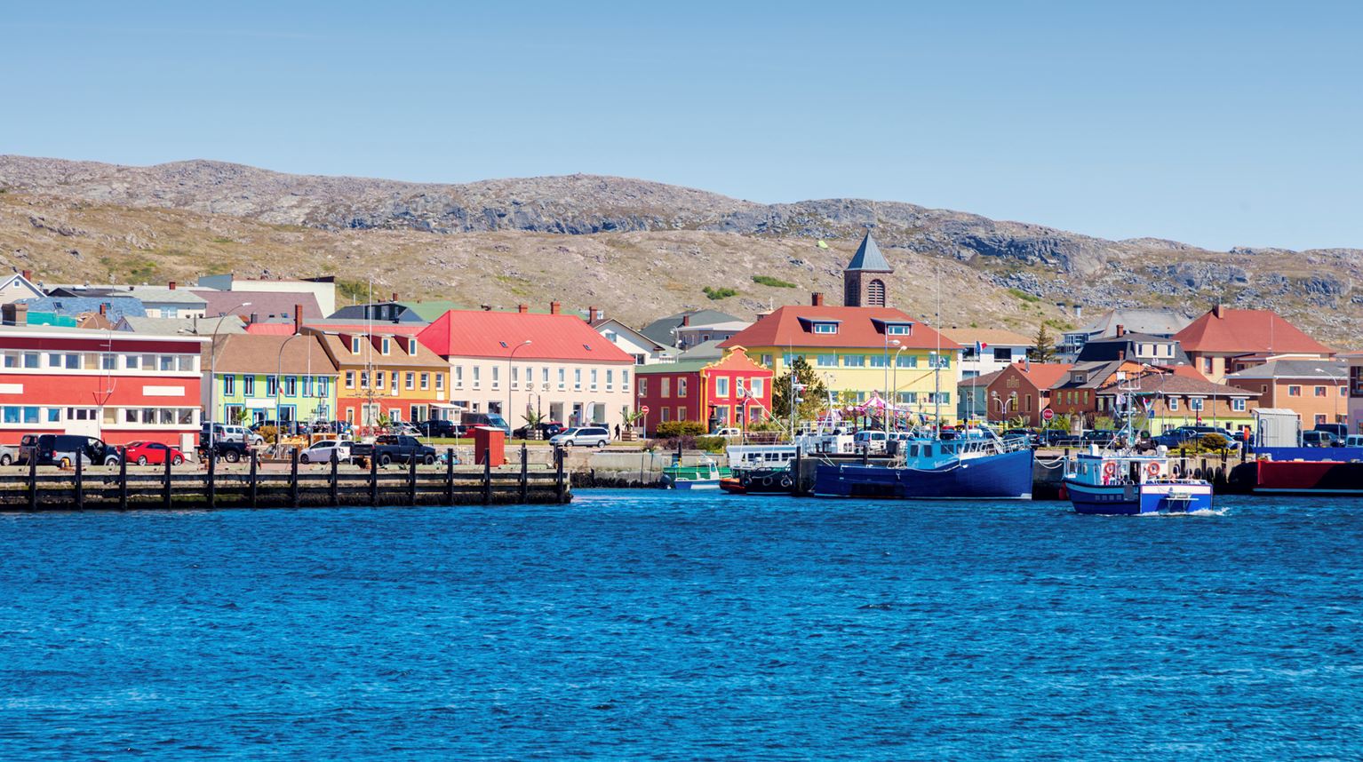 Water view of a small town with colourful houses and boats, Saint Pierre and Miquelon.