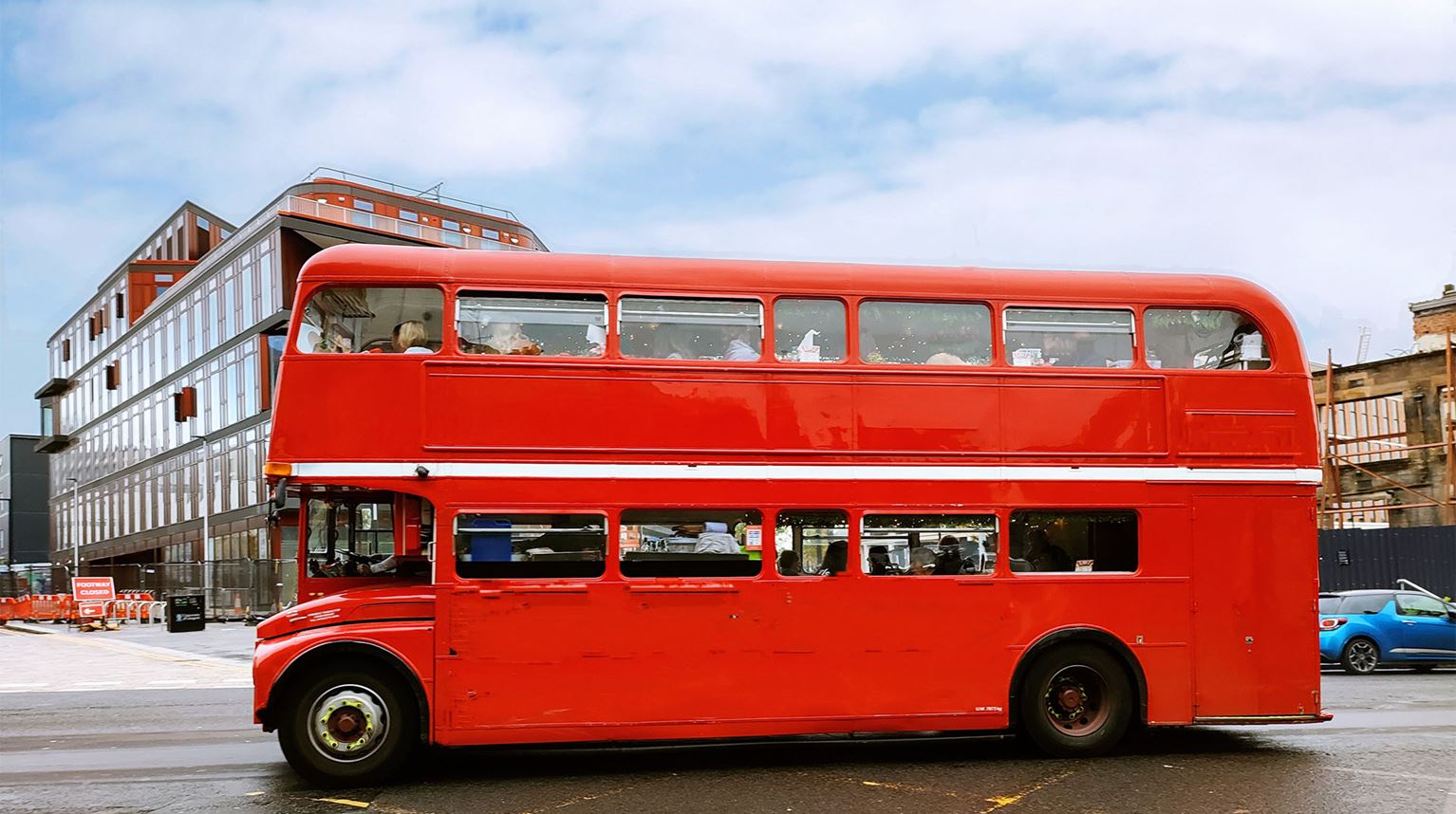 Side view of vintage red double decker bus