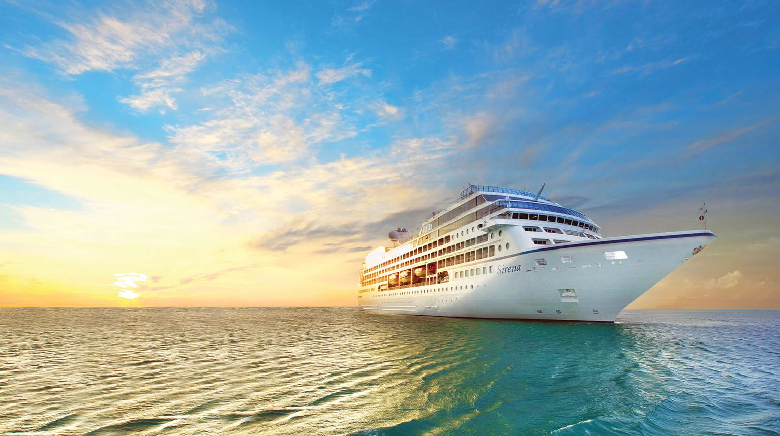 The Sirena cruise ship illuminated by the setting sun at sea. 