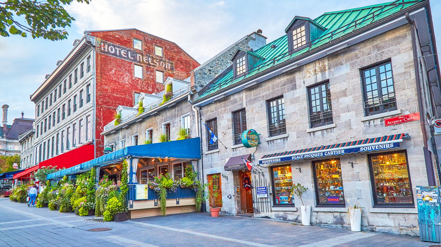 Street of Place Jacques Cartier with low buildings and restaurant s, Old Montreal, Canada 