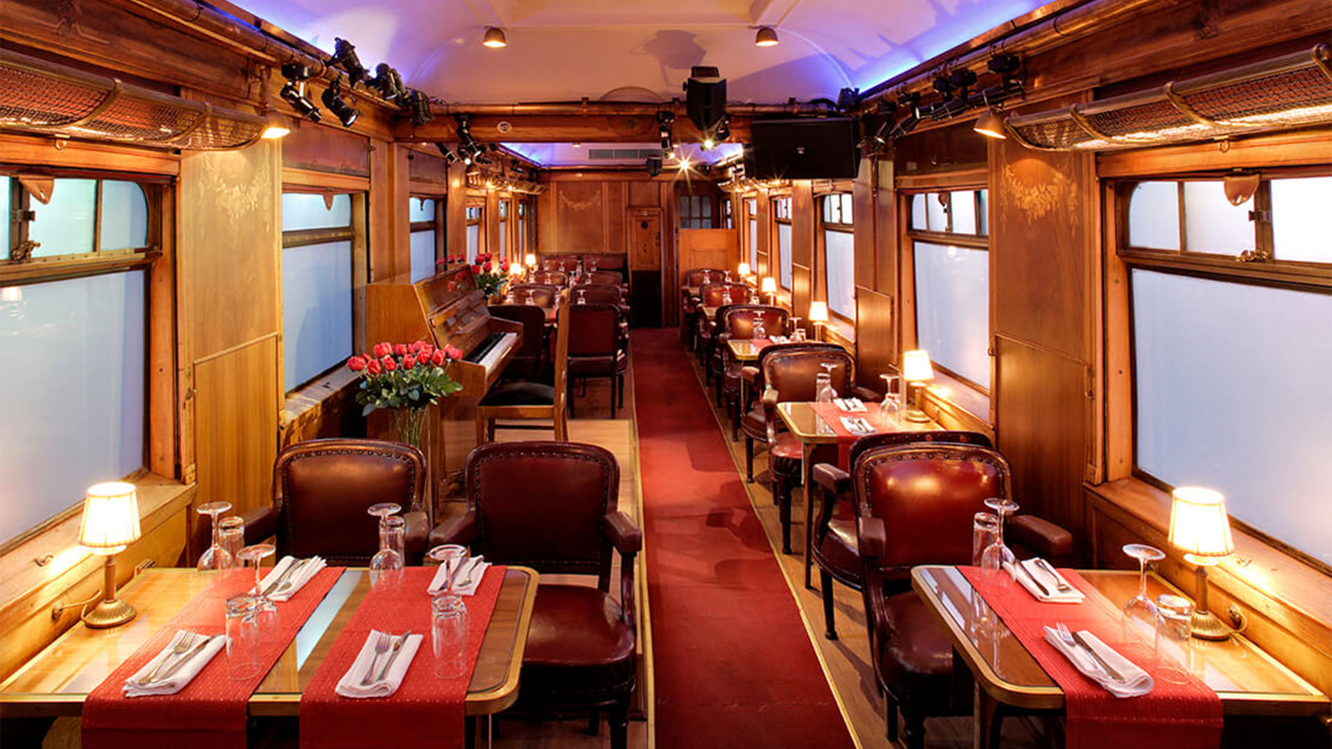 Interior of a richly decorated train car dining room