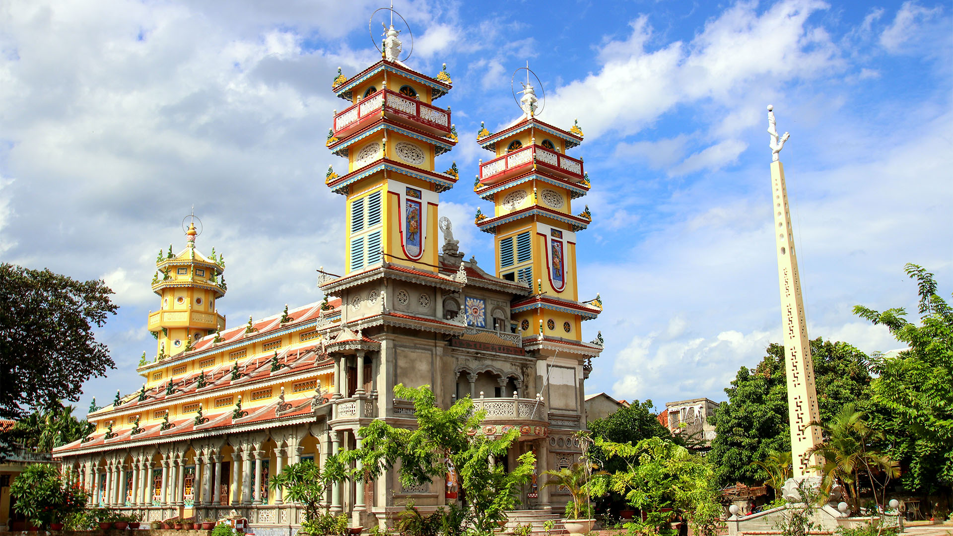 Cao Dai Temple surrounded by lush jungle in Vietnam