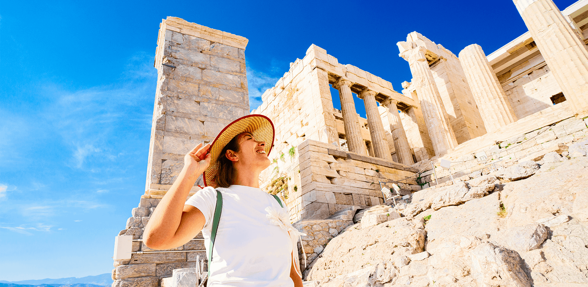 A female tourist admiring the Parthenon in summer