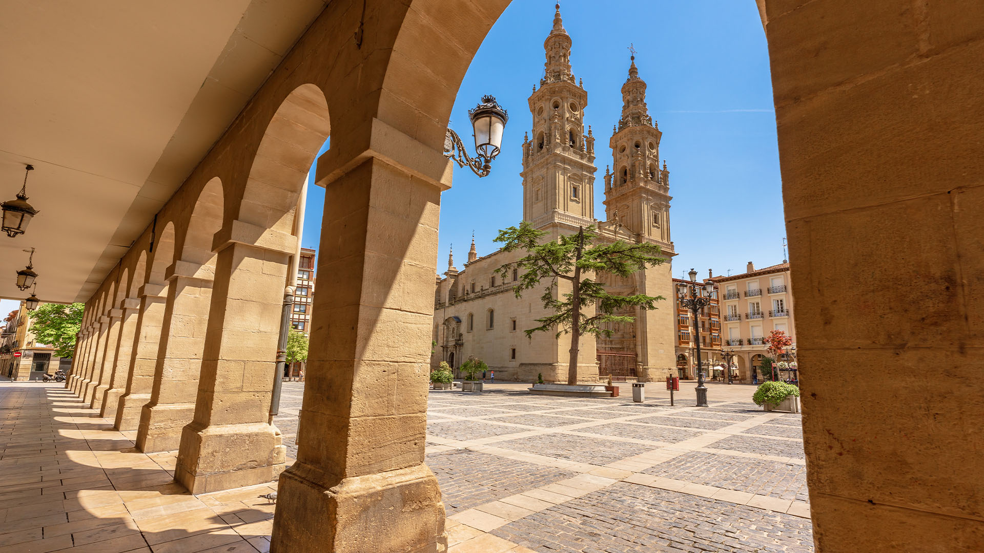 View of Logroño Cathedral through a stone archway