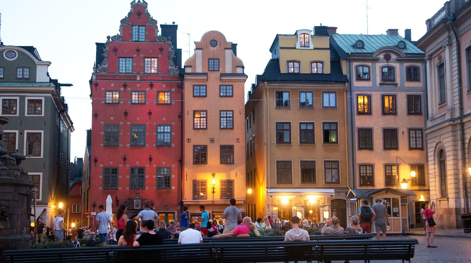 Town square surrounded by tall colourful buildings