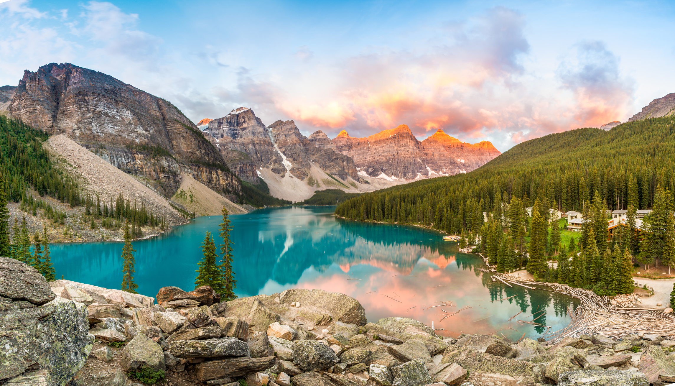 Colouful view of Moraine Lake, forest and mountains reflected in the lake in Banff National Park, Alberta, Canada.