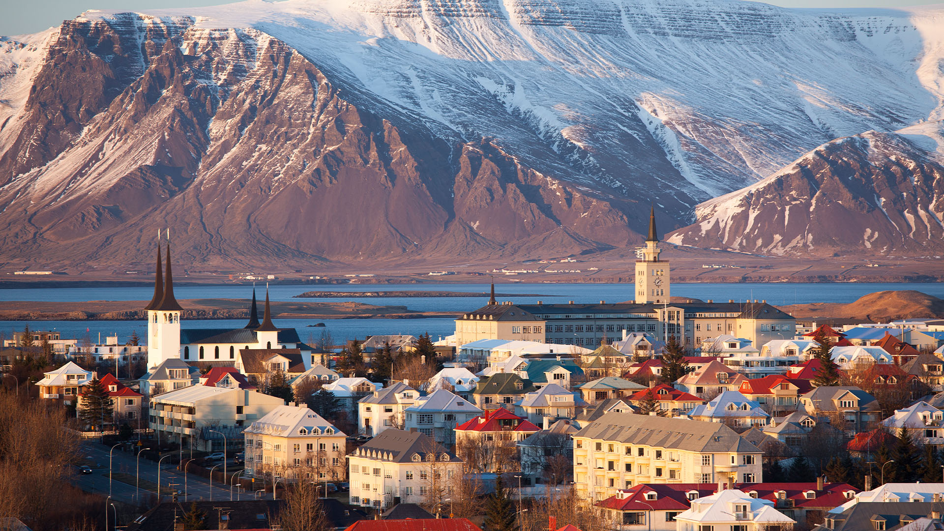 Reykjavik skyline with snowy mountains in the distance