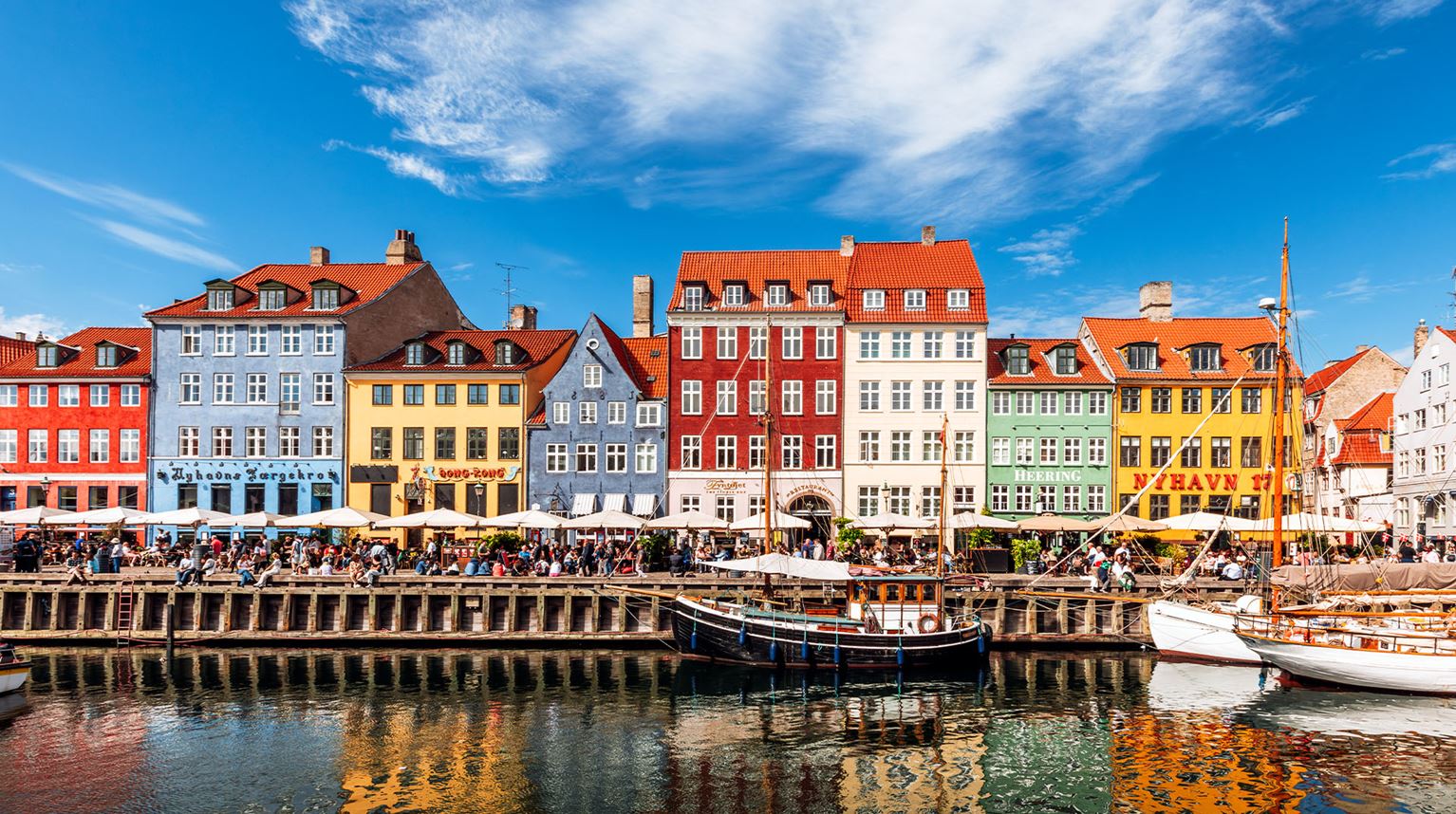 Colourful vibrant houses along a canal on a sunny day