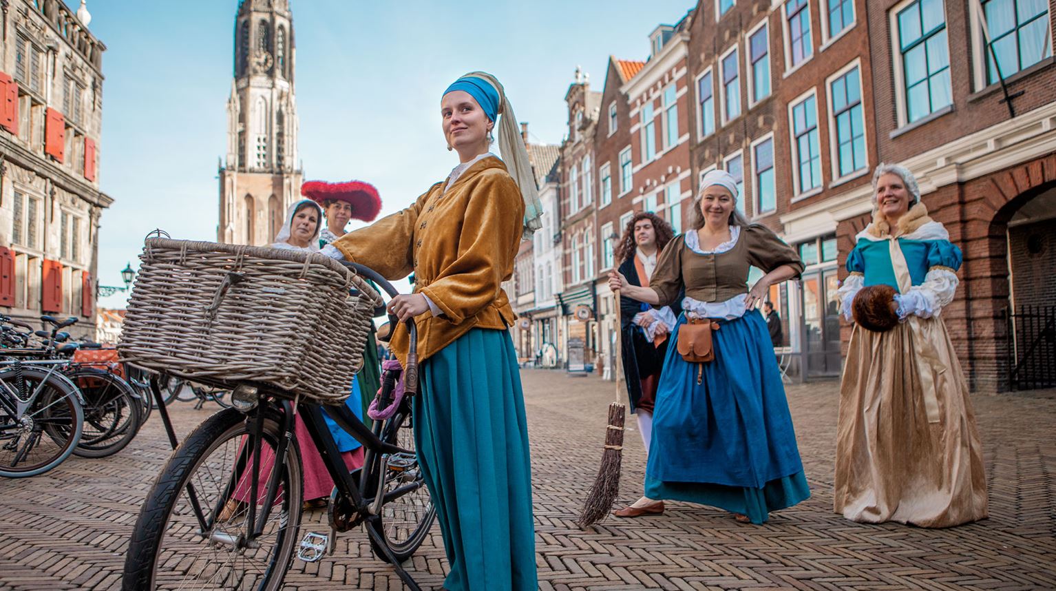 Six female tour guides in traditional Dutch clothes