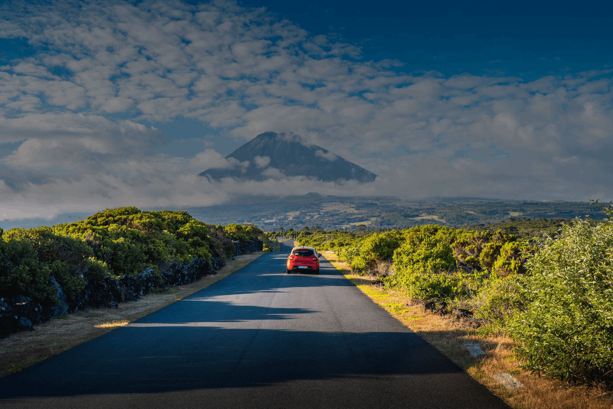 Car driving on a mountain road towards mount Pico, Azores Island, Portugal