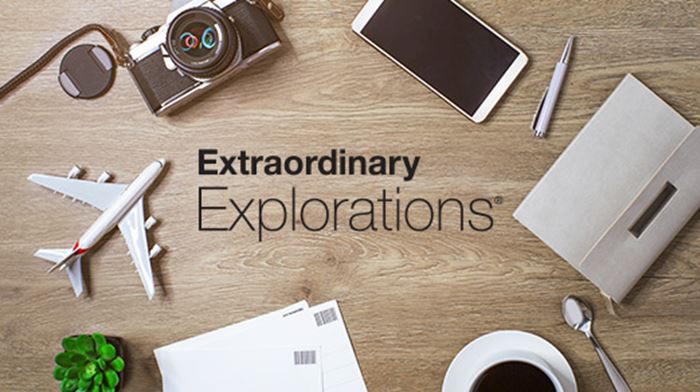 Extraordinary Explorations® logo with plane, camera, mobile phone, pen, and postcard 