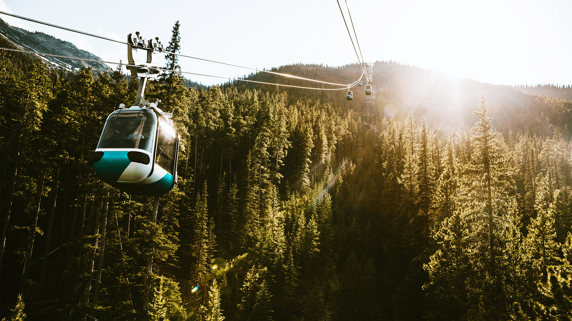 Gondola Lift Going Up Mountain in Banff Canada