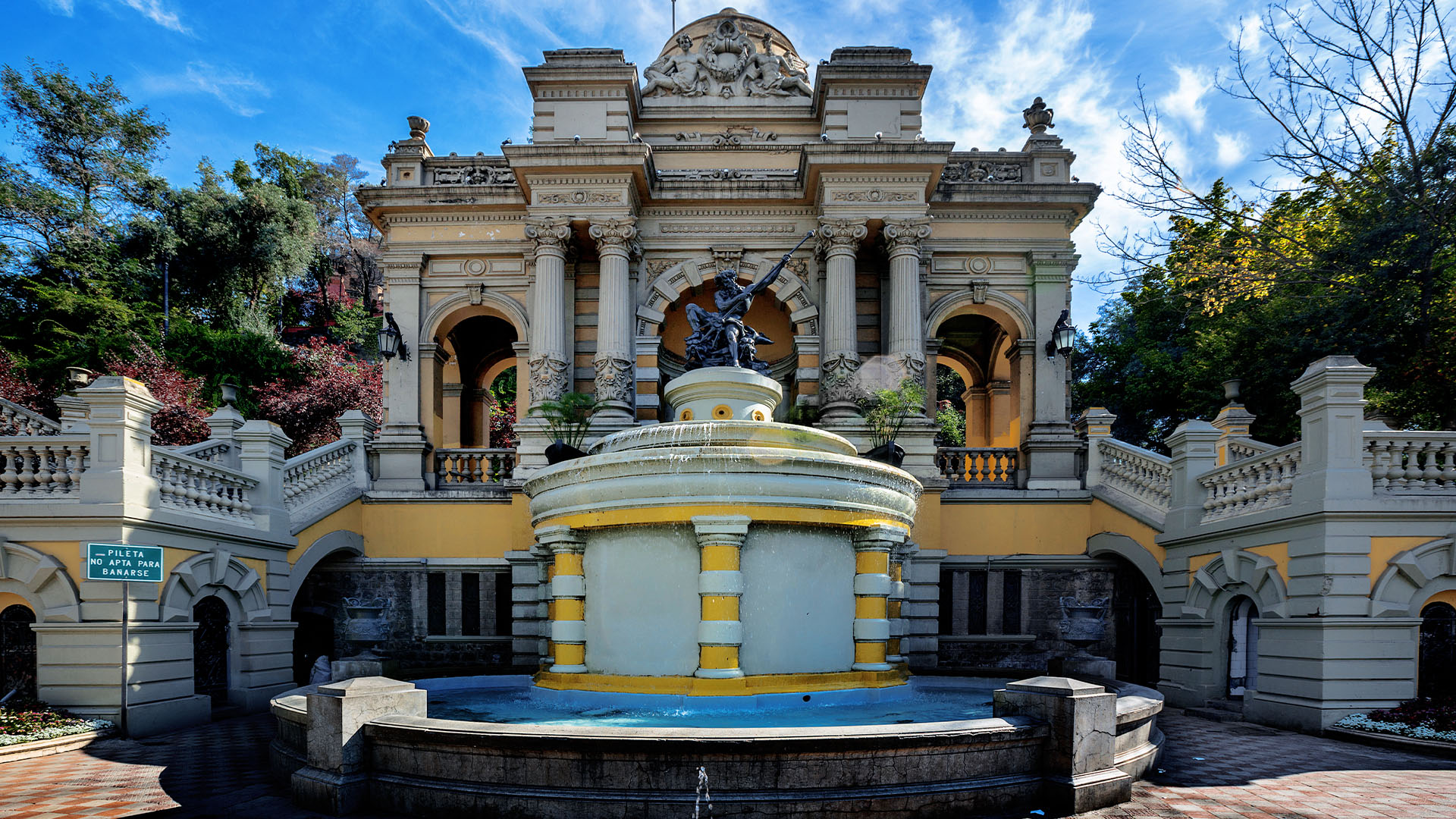 Ornate fountain surrounded by colourful stonework