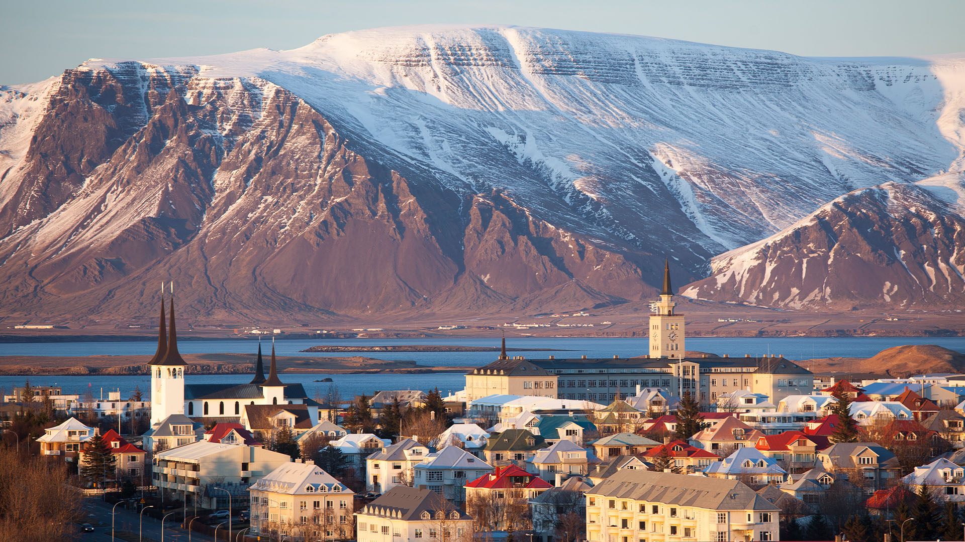 Reykjavík skyline with snow-covered mountains