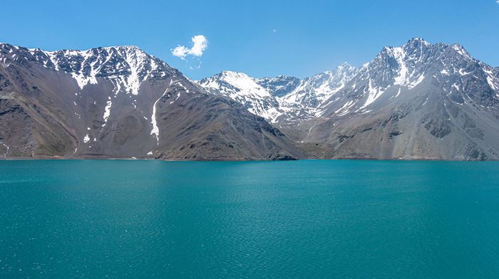 El Yeso Reservoir with mountains in the distance.